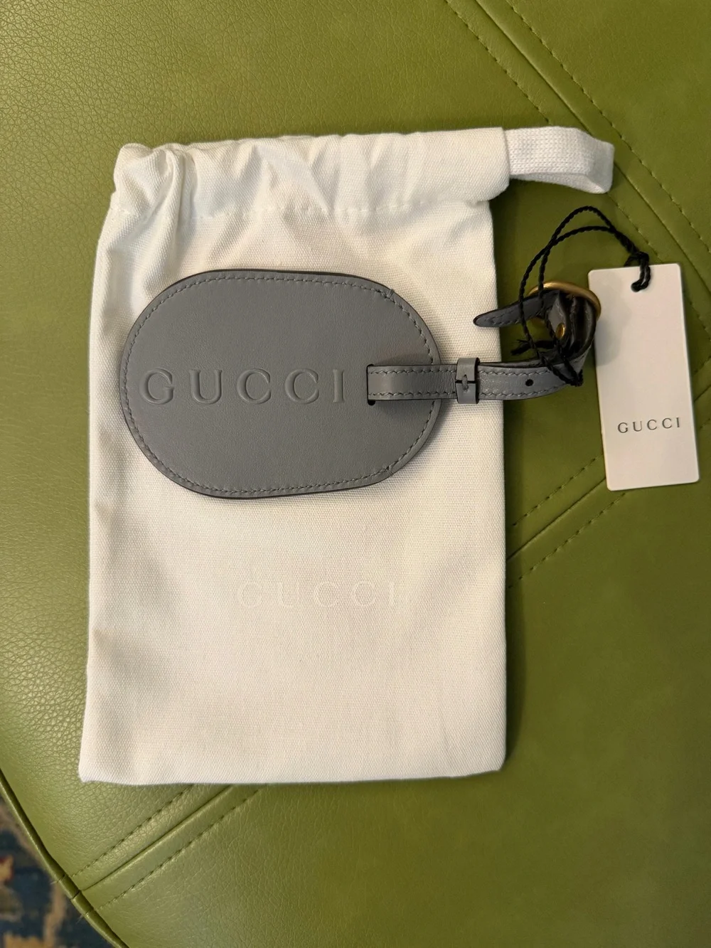 NWT Gucci Gray Oval Leather Luggage Tag with Embossed Logo